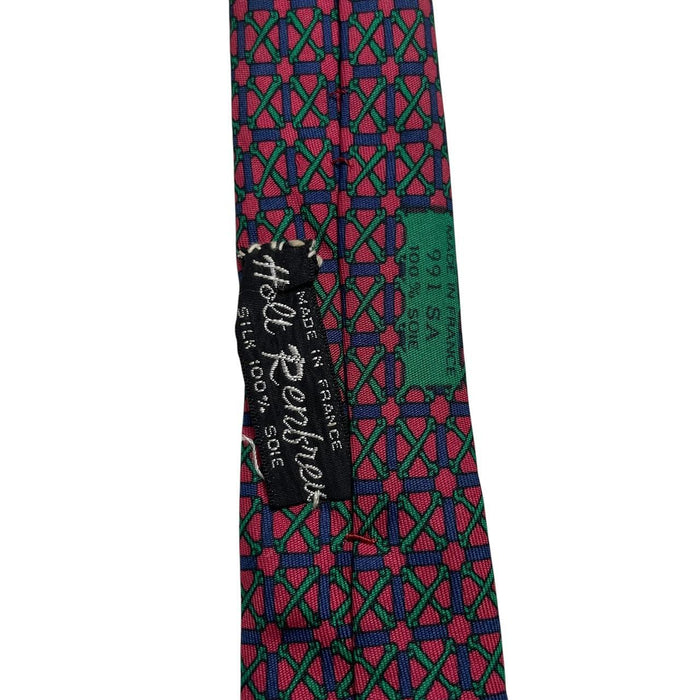 Hermes silk tie featuring geometric print in red, blue, and green colors.