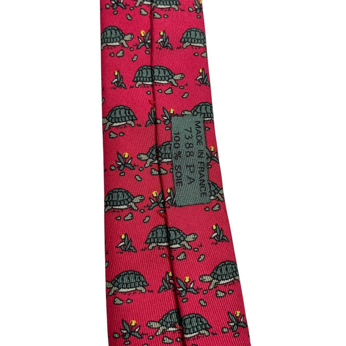 Hermes green and red silk tie featuring turtle print design and logo.