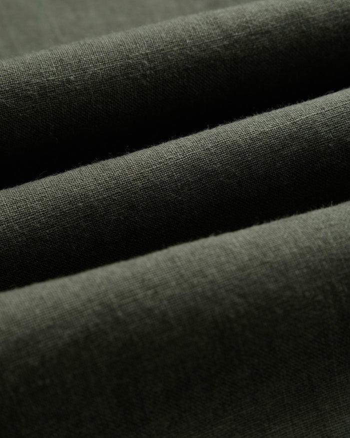The Holiday Linen SS Shirt in dark khaki — close-up of the textured linen fabric