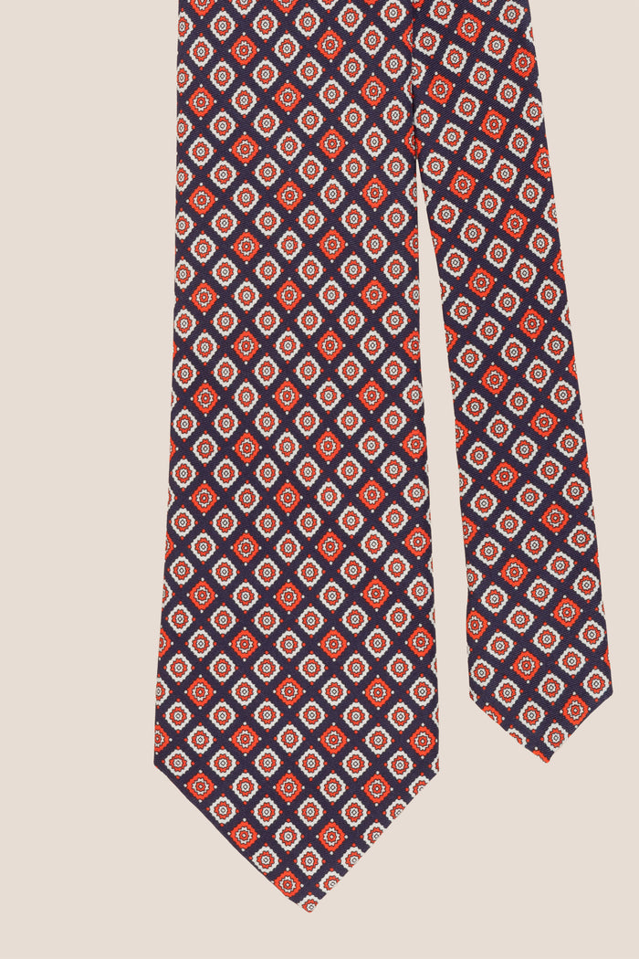 Blue Motif Print Silk Tie with geometric pattern, exuding luxury and sophistication for formal events.