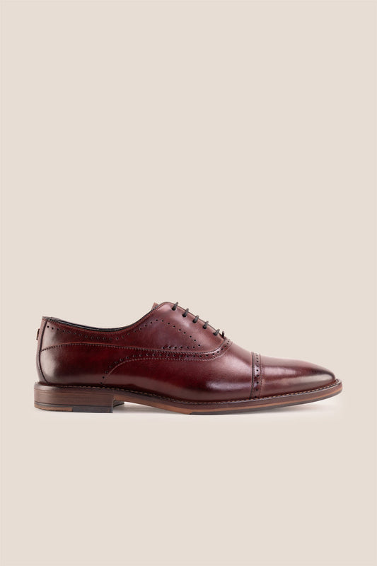 Premium men's Bordo leather oxford shoes by Oswin Hyde London, featuring a cap toe with decorative perforations, closed lacing, contrast welt stitching, and a cushioned teal interior.