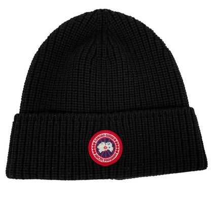 Canada Goose black beanie hat ribbed wool with embroidered logo detail.