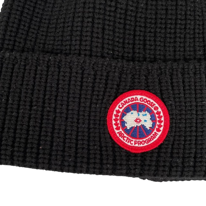 Canada Goose black beanie hat ribbed wool with embroidered logo detail.