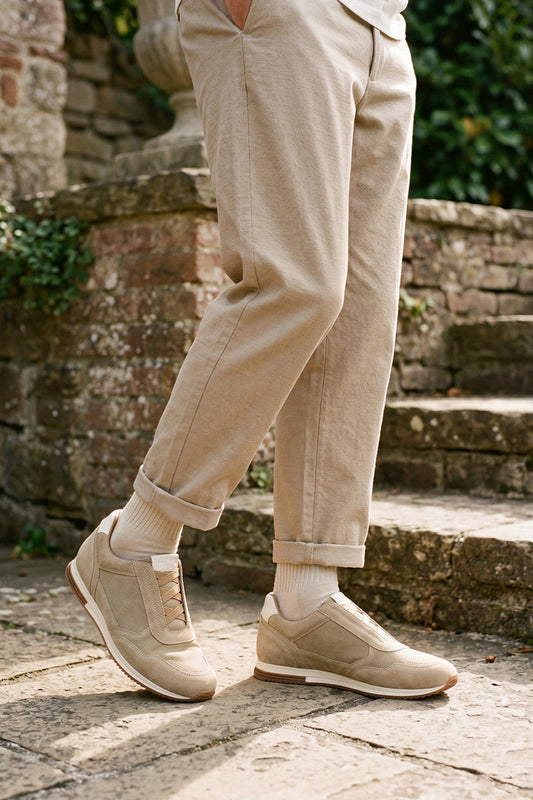 Model wearing Colt sand suede men’s sneakers with elastic sides, premium leather finish, and casual lightweight sole for everyday wear.