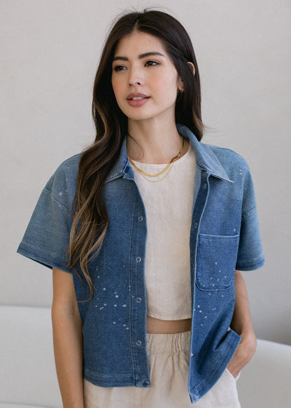 woman wearing cropped indigo short sleeve button down in vintage wash