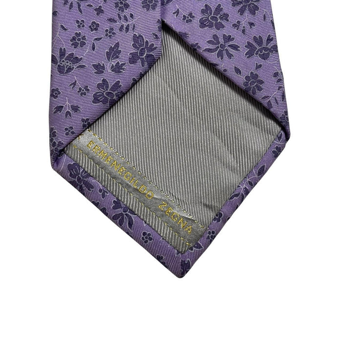 Ermenegildo Zegna purple silk tie with floral pattern and logo detail.