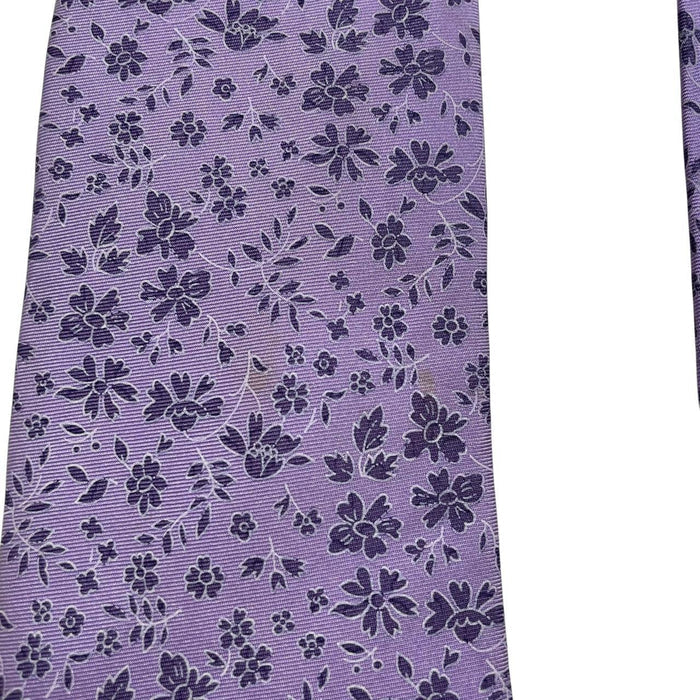 Ermenegildo Zegna purple silk tie with floral pattern and logo detail.