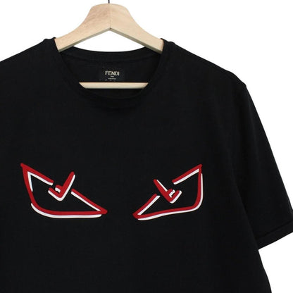Fendi black cotton t-shirt with red Bag Bug eyes graphic and pocket detail.