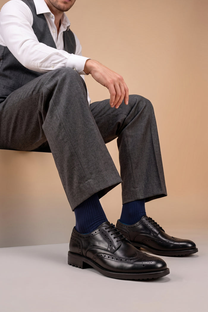 George Black leather shoes for men. Featuring a five-eyelet wing cap brogue design, these shoes offer timeless style and comfort