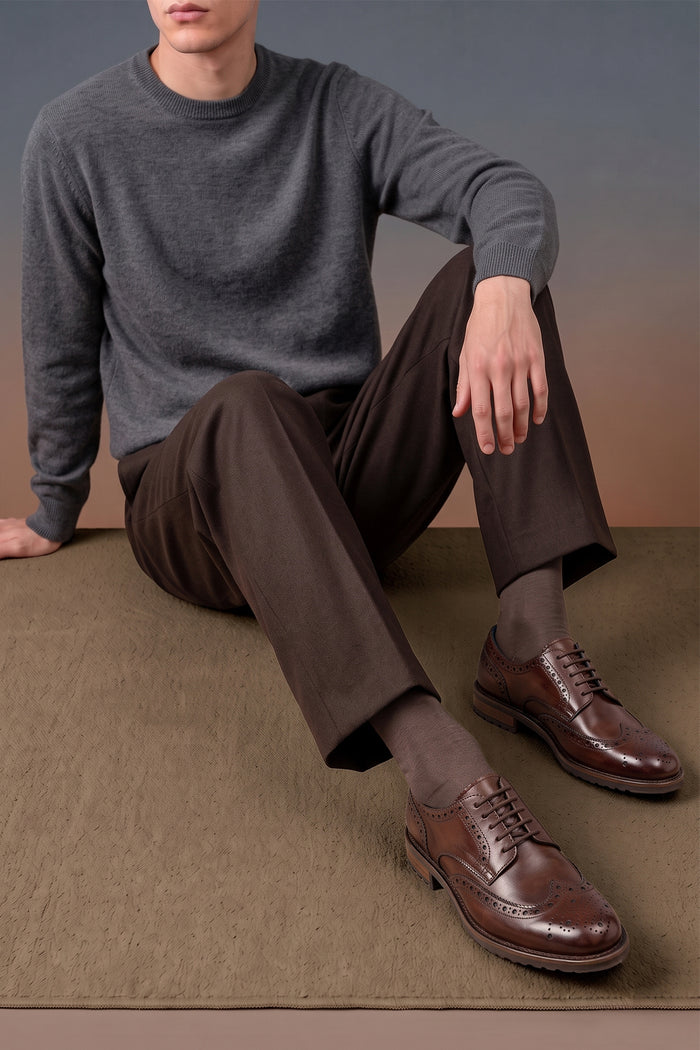 George Brown leather shoes for men. Featuring a five-eyelet wing cap brogue design, these shoes offer timeless style and comfort