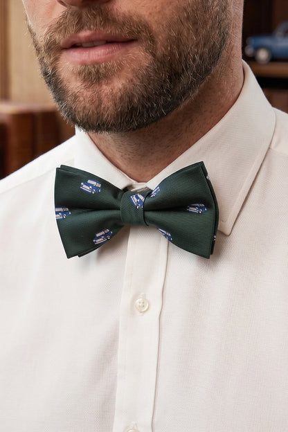 Man wearing Green Mini Bow Tie for men featuring a deep green shade with subtle detailing, crafted for those who appreciate classic elegance and a refined, timeless formal style.