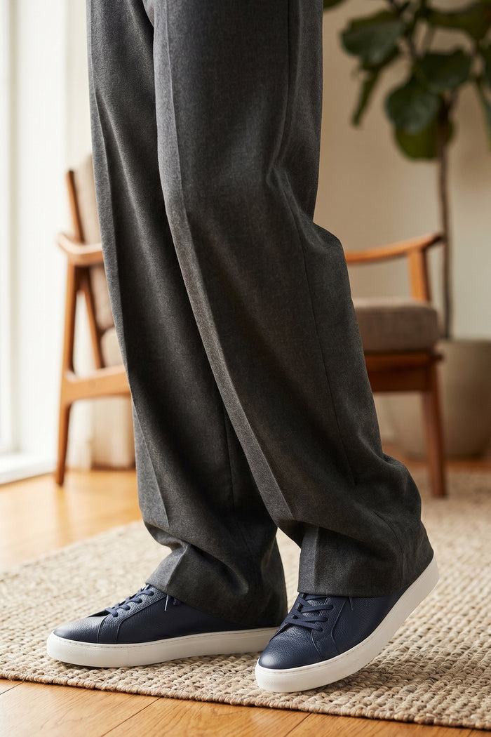 Model wearing Oswin Hyde Harper Navy with white milled leather exuding sophistication and style