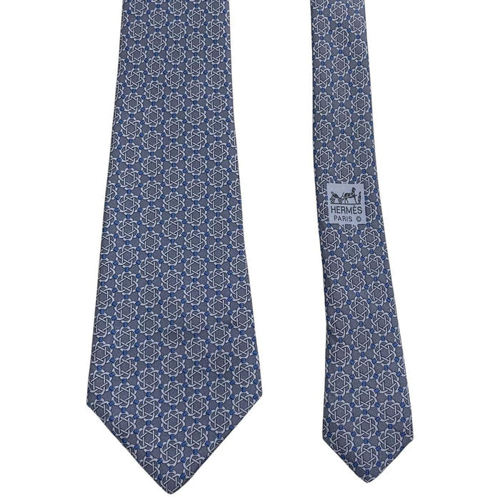 Hermes blue silk tie with geometric print and logo detail.