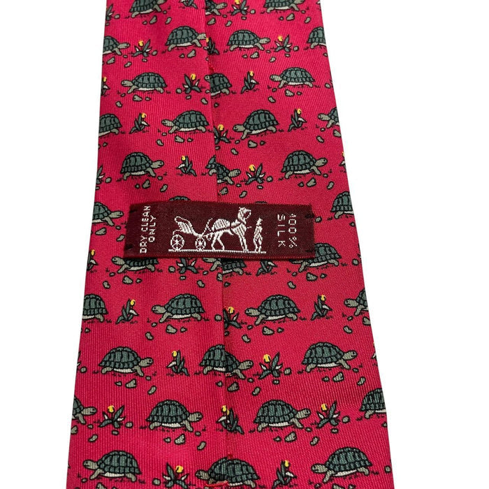 Hermes green and red silk tie featuring turtle print design and logo.