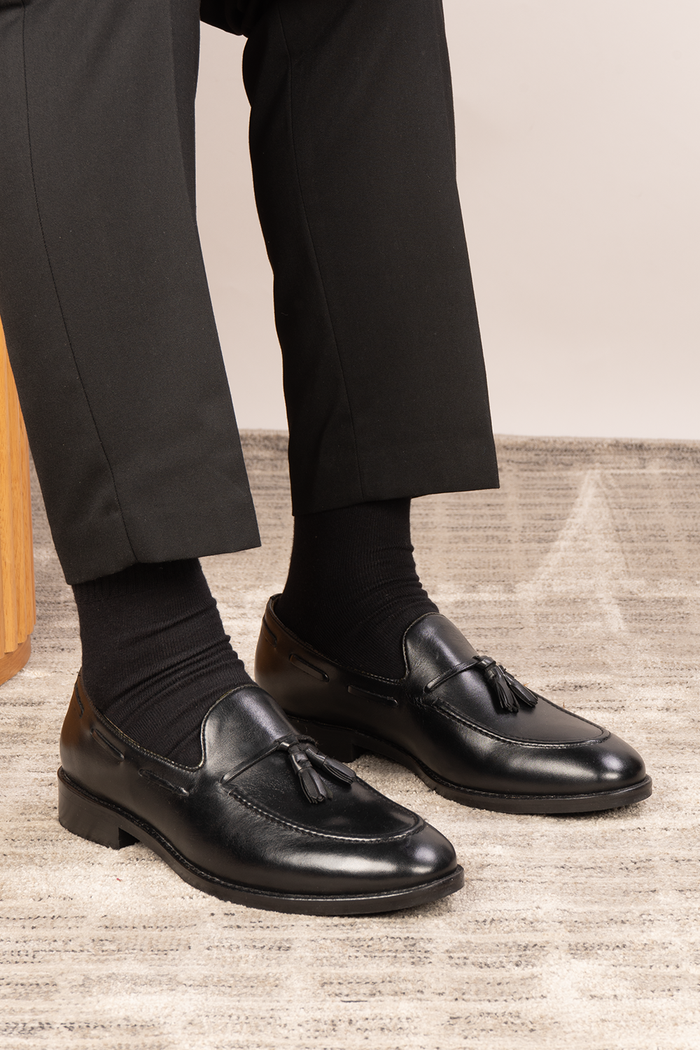 Issac Black Leather Tassel Loafers for men with cushioned sole, premium finish, and timeless style ideal for formal wear and smart-casual outfits.