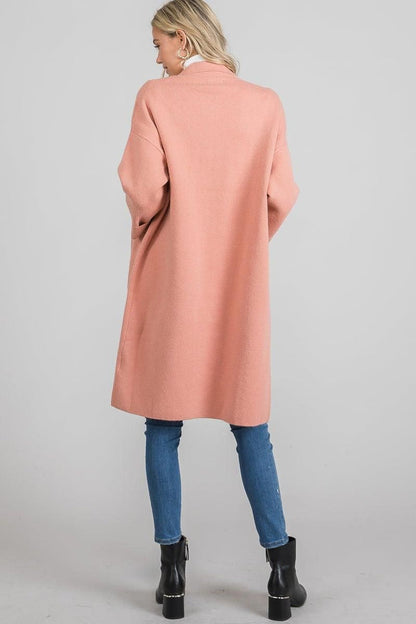 Knee-length dusty mauve coat with an open front, classic collar, and roomy patch pockets by Allie Rose.