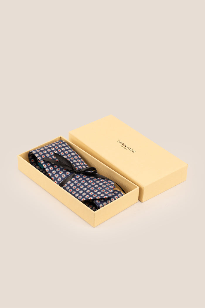 Navy Floral Print Silk Tie with elegant design, offering luxury and sophistication for formal occasions.