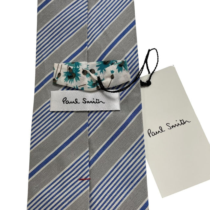 Paul Smith blue and grey striped tie in cotton/silk blend with logo detail.