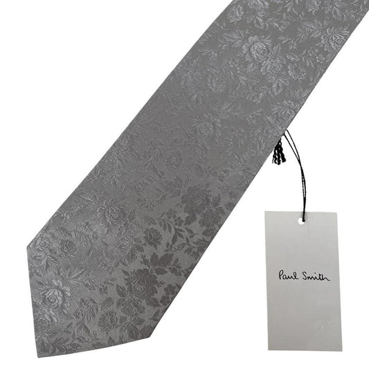 Paul Smith silver silk tie with floral print and brand logo detail.