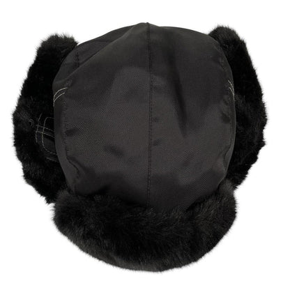 Paul Smith black nylon trapper hat with tags, featuring classic design and logo details.