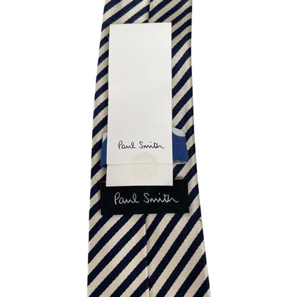 Paul Smith cream and black striped silk tie with logo and brand tags.