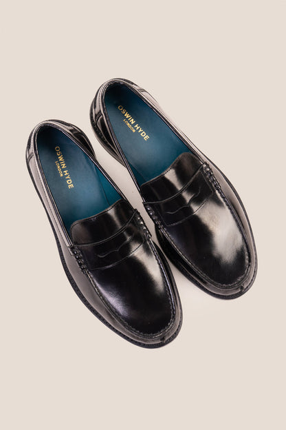 Oswin Hyde Peter Black leather penny loafers for men, crafted to deliver a classic and refined style. Constructed from premium leather
