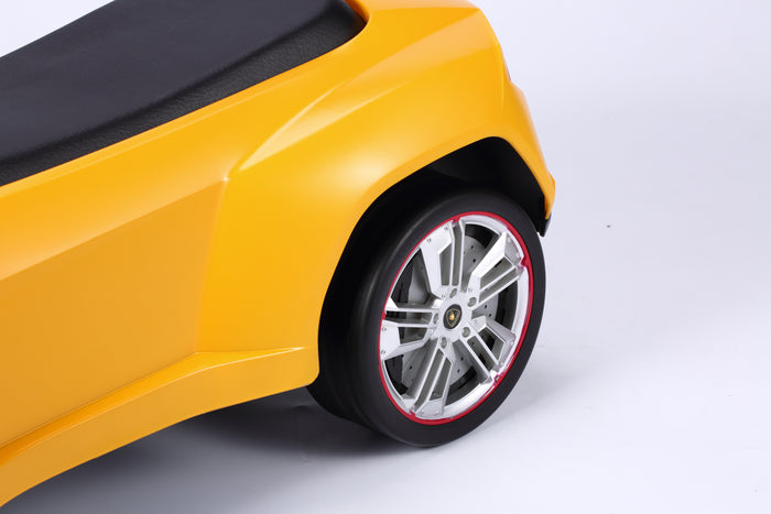 Child riding Rastar Licensed Lamborghini Urus foot to floor push car