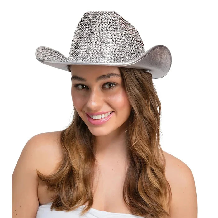 Lady wearing a silver cowboy hat covered in rhinestones