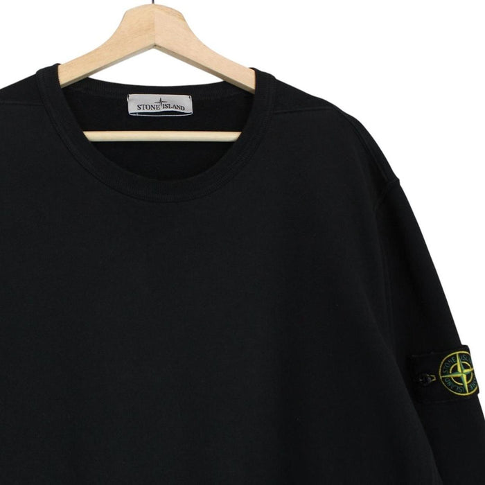 Stone Island black cotton sweatshirt with embroidered compass logo and ribbed cuffs.