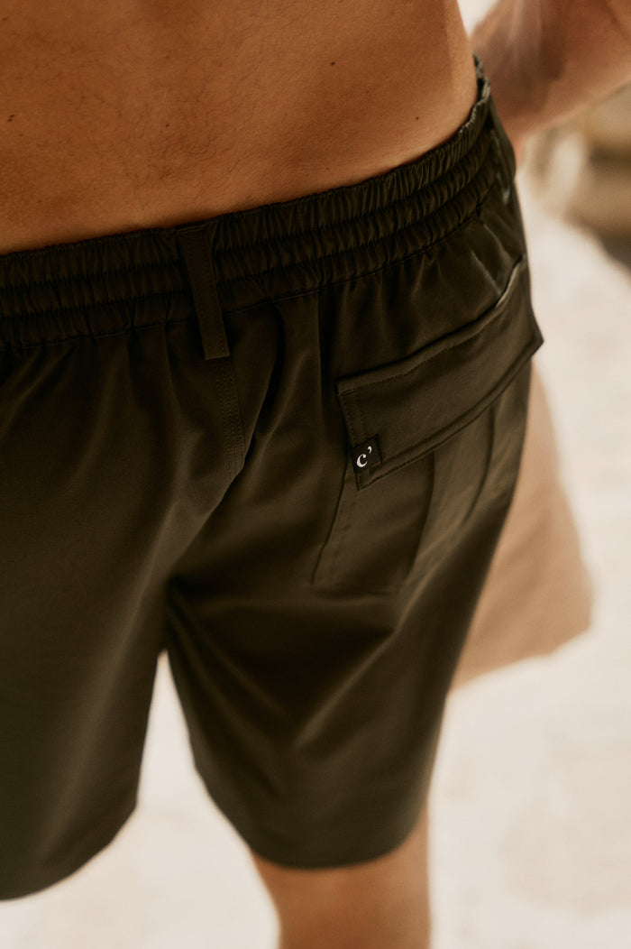 The Board Shorts in khaki — close-up of the side cargo pocket and elastic waistband