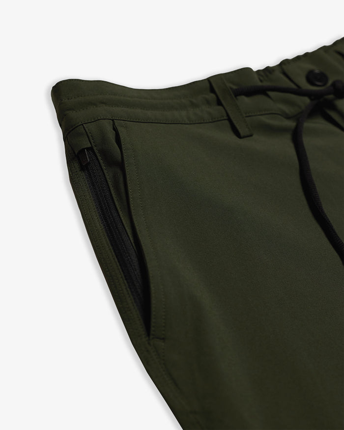 The Board Shorts in khaki — close-up of the zippered pocket and drawstring