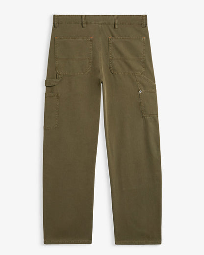 A back view of The Carpenter Pant in olive green, laid flat on a white background. The image highlights the back pockets, the hammer loop, and the copper-toned rivets. | c'est normal
