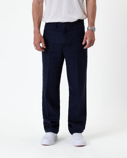 The Daily Linen Trouser in navy — front view showing the straight leg silhouette