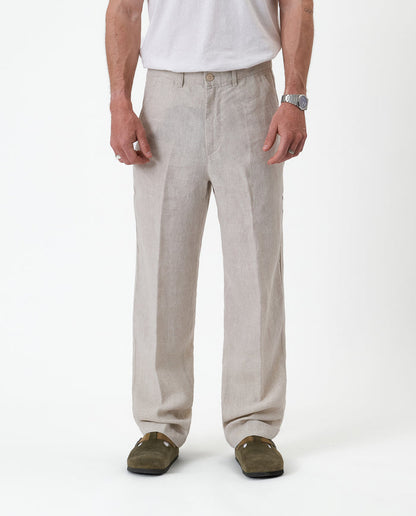 The Daily Linen Trouser in natural — front view showing the straight leg and pressed crease