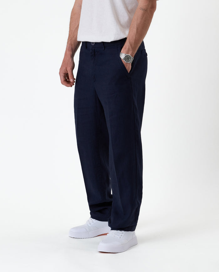 The Daily Linen Trouser in navy — side view showing the straight leg silhouette