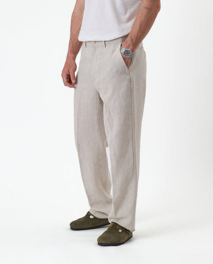 The Daily Linen Trouser in natural — front view with a pressed crease down the leg