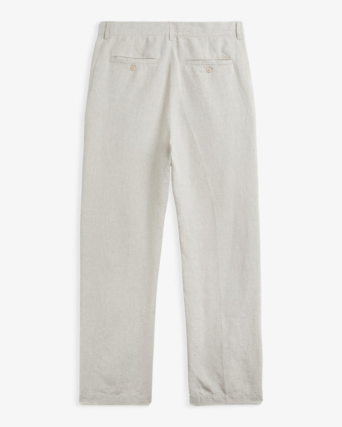 The Daily Linen Trouser in natural — back view with functional welt pockets and button closure