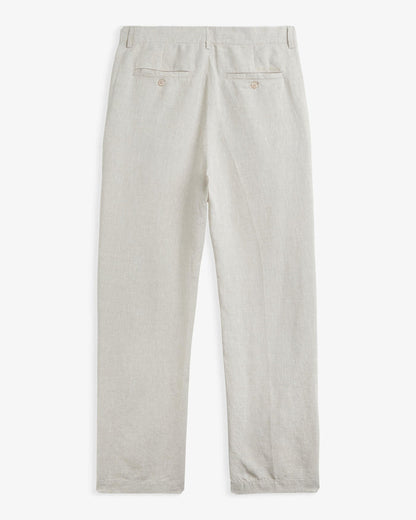 The Daily Linen Trouser in natural — back view with functional welt pockets and button closure