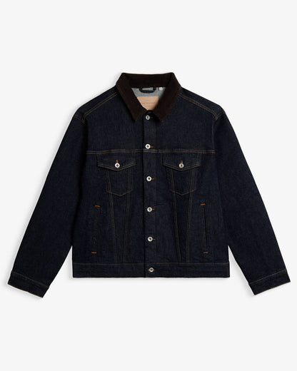 The Denim Jacket in rinse blue — featuring a contrasting brown corduroy collar