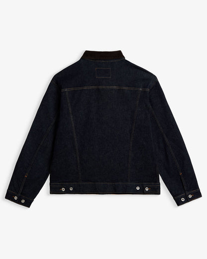 The Denim Jacket in rinse blue — back view showing the dark wash and corduroy collar