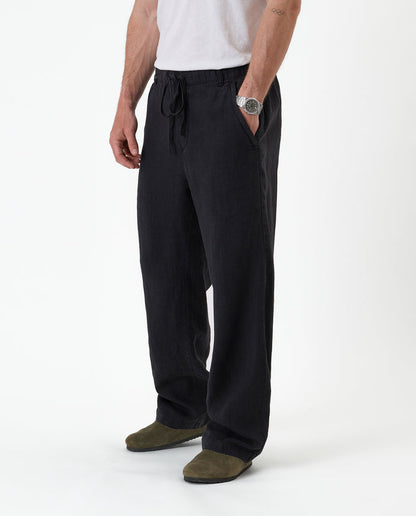 The Holiday Linen Trouser in black — front view against a white background