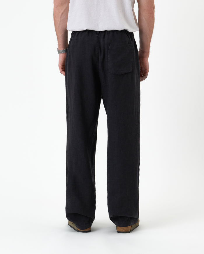 The Holiday Linen Trouser in black — back view against a white background