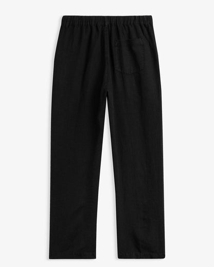 The Holiday Linen Trouser in black — back view with an elastic waistband and single pocket
