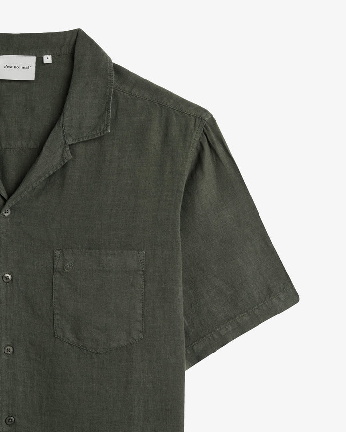 The Holiday Linen SS Shirt in Dark Khaki — close-up of the chest pocket and collar