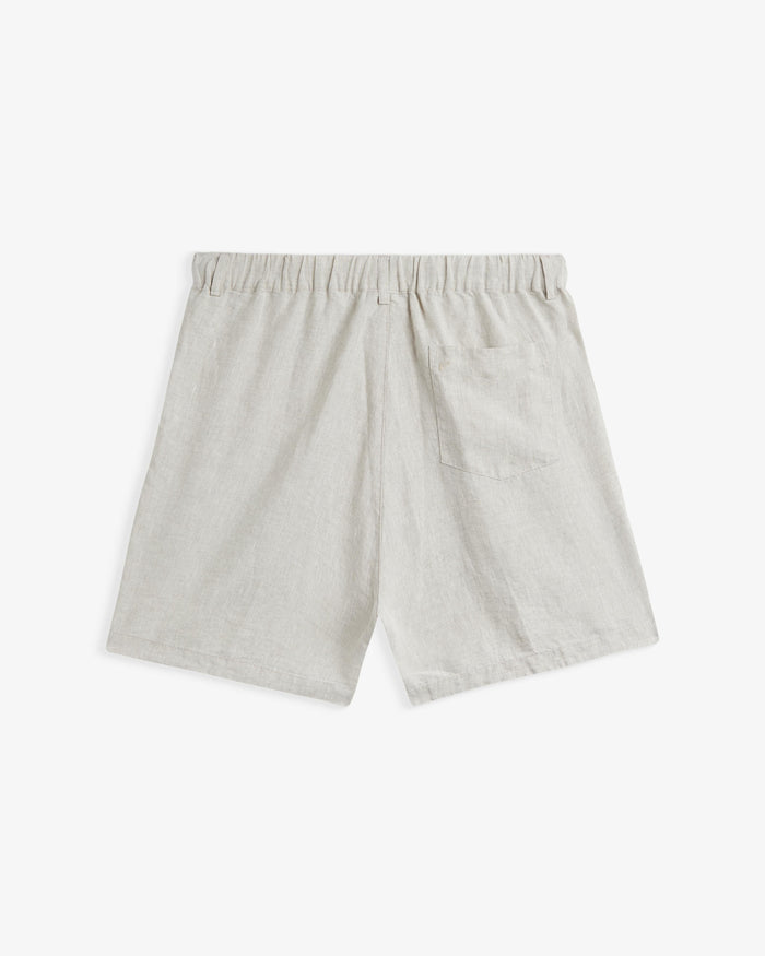 The Holiday Linen Short in natural — back view showing the rear pocket