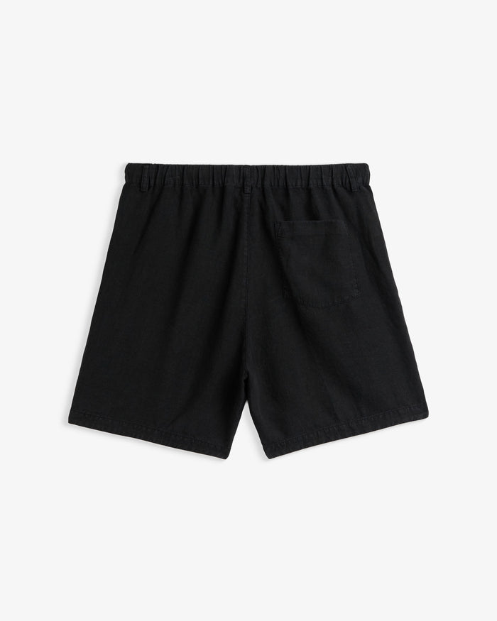 The Holiday Linen Short in black — back view showing the elastic waistband and pocket