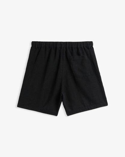 The Holiday Linen Short in black — back view showing the elastic waistband and pocket