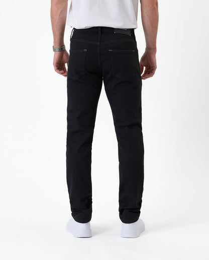 The Jeans Slim Fit in Jet Black — back view showing the slim silhouette