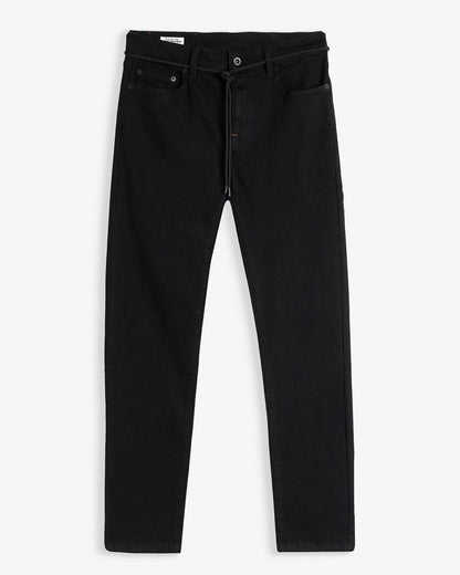 A front view of The Jeans Slim Fit in Jet Black, laid flat on a white background. The image highlights the clean slim silhouette, five-pocket design, and zip fly with top button.