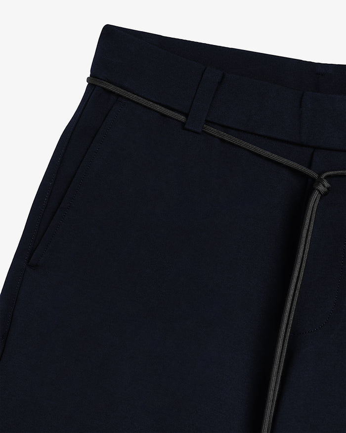 The Proper Pant Relaxed Straight Fit in navy — close-up of the adjustable drawcord.